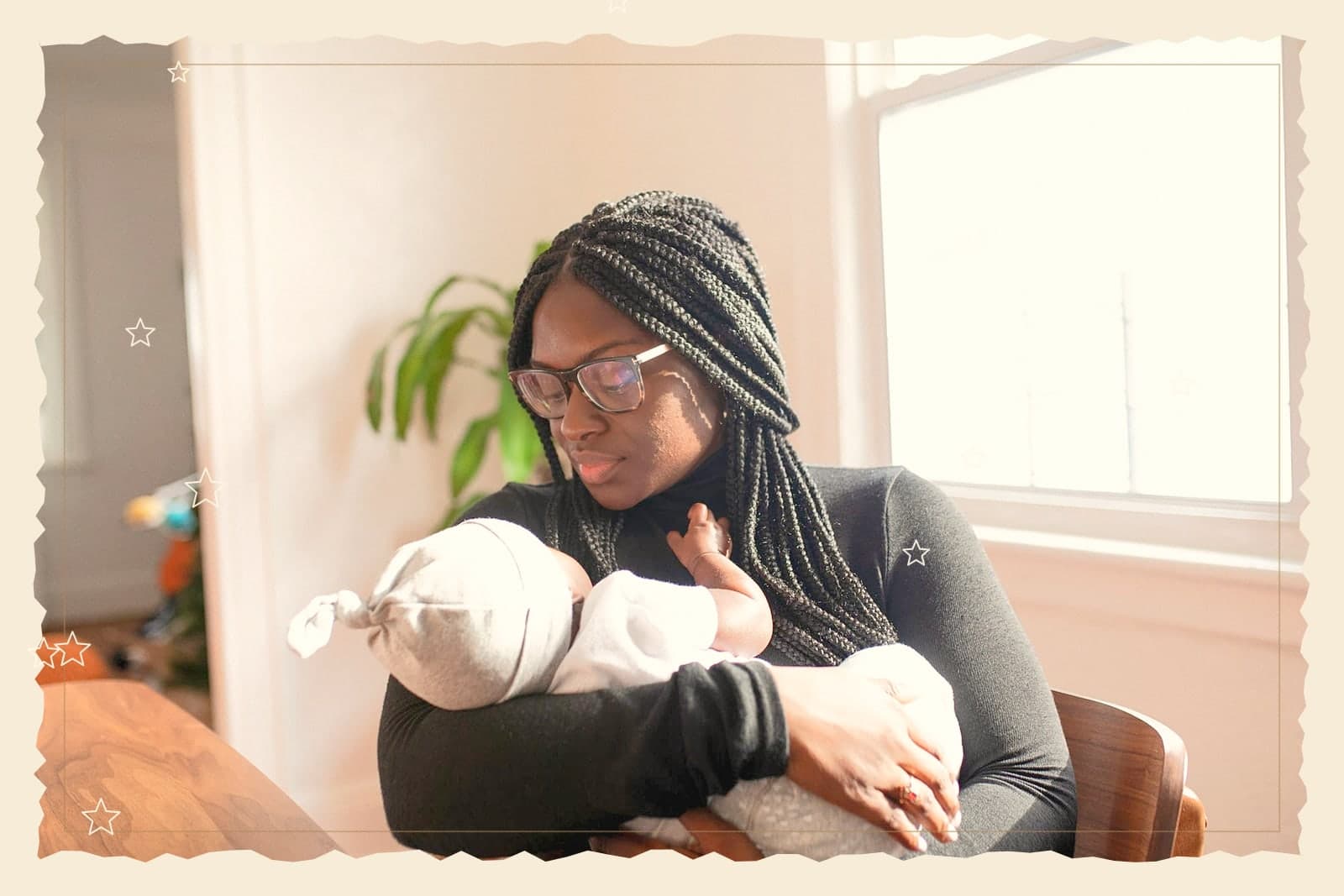 A mother holding her newborn in Storybook, framed like a page from a bedtime story